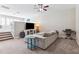 Upstairs living area with plenty of comfortable seating, wall-mounted TV, and neutral decor at 5823 Terncrest Dr, Lithia, FL 33547