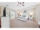 Spacious primary bedroom boasts neutral walls, plush carpet, and a view to the elegant ensuite bathroom at 5823 Terncrest Dr, Lithia, FL 33547