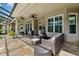 Spacious covered patio featuring a fire pit, comfortable seating, and tile flooring perfect for gatherings at 5823 Terncrest Dr, Lithia, FL 33547