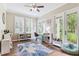Bright playroom area with hardwood floors and a door to the backyard at 5823 Terncrest Dr, Lithia, FL 33547
