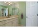 Bright bathroom featuring large vanity, ample storage, and stylish fixtures at 6340 Garland Ct, New Port Richey, FL 34652