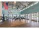 Large community clubhouse lounge area featuring high ceilings, a dance floor, and waterfront views at 6340 Garland Ct, New Port Richey, FL 34652