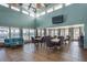 Community clubhouse common area featuring high ceilings, tile floors, and a dining area at 6340 Garland Ct, New Port Richey, FL 34652