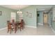 Bright dining room features tile flooring, chandelier, and a view to adjacent room at 6340 Garland Ct, New Port Richey, FL 34652