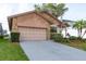 Charming single Gathering home features a two car garage, stone accents, and lovely landscaping at 6340 Garland Ct, New Port Richey, FL 34652