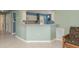 Open-concept kitchen with a breakfast bar, great for entertaining, and tile flooring at 6340 Garland Ct, New Port Richey, FL 34652
