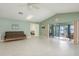 Bright living room offering seamless transition to outdoor entertainment with a water view at 6340 Garland Ct, New Port Richey, FL 34652