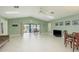 Spacious living room with tile floors, lots of natural light and a water view through sliding glass doors at 6340 Garland Ct, New Port Richey, FL 34652