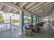 Covered patio in the community clubhouse featuring water views and comfortable seating at 6340 Garland Ct, New Port Richey, FL 34652