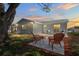 Backyard with chairs and sunset at 6442 Sutherland Ave, New Port Richey, FL 34653