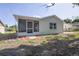 The backyard includes a screened-in porch, providing an inviting outdoor space for relaxation and entertainment at 6442 Sutherland Ave, New Port Richey, FL 34653