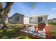 Charming backyard seating area with a lush green lawn and patio at 6442 Sutherland Ave, New Port Richey, FL 34653