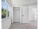 Bright bedroom with a window with view and closet at 6442 Sutherland Ave, New Port Richey, FL 34653