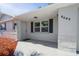 Inviting entryway showcasing the home's fresh exterior paint and covered porch at 6442 Sutherland Ave, New Port Richey, FL 34653