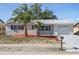 Charming single-story home featuring a well-manicured lawn and freshly painted exterior at 6442 Sutherland Ave, New Port Richey, FL 34653