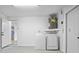 Functional laundry room with modern washer and dryer units at 6442 Sutherland Ave, New Port Richey, FL 34653