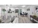 Open living space featuring modern finishes and seamless transition to updated kitchen at 6442 Sutherland Ave, New Port Richey, FL 34653