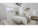 Bright bedroom with stylish decor, a large bed, and a window that allows natural light at 6442 Sutherland Ave, New Port Richey, FL 34653
