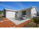 Cozy patio with comfortable seating, ideal for outdoor entertaining at 6442 Sutherland Ave, New Port Richey, FL 34653