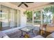 Relaxing sunroom with lots of natural light and seating area at 6442 Sutherland Ave, New Port Richey, FL 34653
