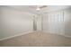 Bedroom with neutral walls, carpet, a ceiling fan, and a large closet at 6841 Mitchell Cir, Tampa, FL 33634