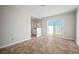 Bright bedroom featuring tile flooring, sliding glass door to the yard, and a built-in sink at 6841 Mitchell Cir, Tampa, FL 33634