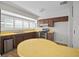 Kitchen featuring wood cabinetry, stainless steel appliances, and laminate countertops at 6841 Mitchell Cir, Tampa, FL 33634