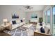 Living room with modern furniture, a ceiling fan, and sliding glass doors to backyard at 6841 Mitchell Cir, Tampa, FL 33634