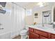 Bright bathroom with tub and shower combo, sink, and vanity at 6934 Duffy Ln, Tampa, FL 33616