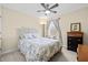 Comfortable bedroom with ceiling fan, window and bedside drawers at 6934 Duffy Ln, Tampa, FL 33616