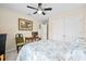 Cozy bedroom with ceiling fan, natural light, and closet at 6934 Duffy Ln, Tampa, FL 33616