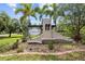 Beautiful stone community sign with lush landscaping and palm trees at 6934 Duffy Ln, Tampa, FL 33616