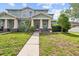 Charming two-story townhome with a well-manicured lawn and inviting entrance at 6934 Duffy Ln, Tampa, FL 33616