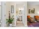 Hallway view leading to a convenient half bathroom at 6934 Duffy Ln, Tampa, FL 33616