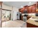 Well-equipped kitchen with stainless steel appliances and access to an outdoor patio at 6934 Duffy Ln, Tampa, FL 33616