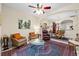 Cozy living room with comfortable seating and elegant décor and a view to the dining area at 6934 Duffy Ln, Tampa, FL 33616
