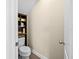 Half bathroom, with toilet and shelf space at 6934 Duffy Ln, Tampa, FL 33616
