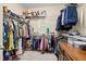 Spacious walk-in closet features ample hanging space and shelving for organization at 6934 Duffy Ln, Tampa, FL 33616