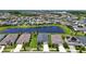 An aerial view of a neighborhood with a lake and several houses with well-maintained yards at 7116 Estero Ct, Apollo Beach, FL 33572