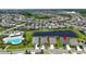 An aerial view showing the home's location within a community with access to a lake and pool at 7116 Estero Ct, Apollo Beach, FL 33572