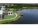 Breathtaking aerial view of community with picturesque lake and dock, perfect for relaxing or taking in the scenery at 7116 Estero Ct, Apollo Beach, FL 33572