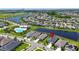 Aerial view of a home in a Primary planned community with water features, community pools and green spaces at 7116 Estero Ct, Apollo Beach, FL 33572