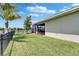 Manicured backyard featuring a fence with water views at 7116 Estero Ct, Apollo Beach, FL 33572