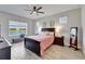 Serene bedroom featuring a water view, natural light, and plank flooring at 7116 Estero Ct, Apollo Beach, FL 33572