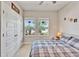 Cozy bedroom with a ceiling fan, a double window view, and a large closet space at 7116 Estero Ct, Apollo Beach, FL 33572