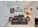 Bonus room with recliners, neutral carpet, and sports-themed decor at 7116 Estero Ct, Apollo Beach, FL 33572