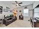 Relaxing bonus room featuring soft carpet, media center, and fan decorations at 7116 Estero Ct, Apollo Beach, FL 33572