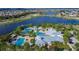 Community center with multiple pools, lounge chairs, and lush landscaping at 7116 Estero Ct, Apollo Beach, FL 33572