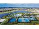 Aerial shot highlighting the community center, pool, tennis, and basketball courts and lake at 7116 Estero Ct, Apollo Beach, FL 33572