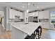 Gourmet kitchen with stainless steel appliances, a large island, and pendant lighting at 7116 Estero Ct, Apollo Beach, FL 33572